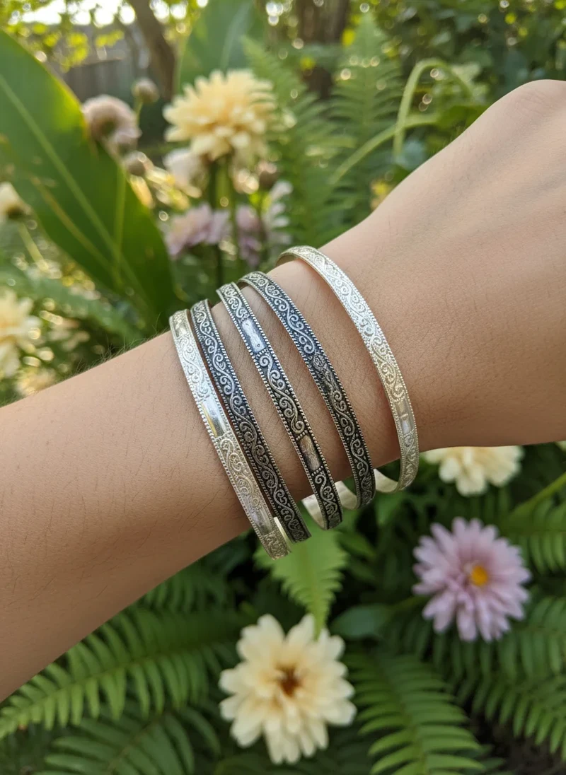 Silver & black ornate bangle bracelets.