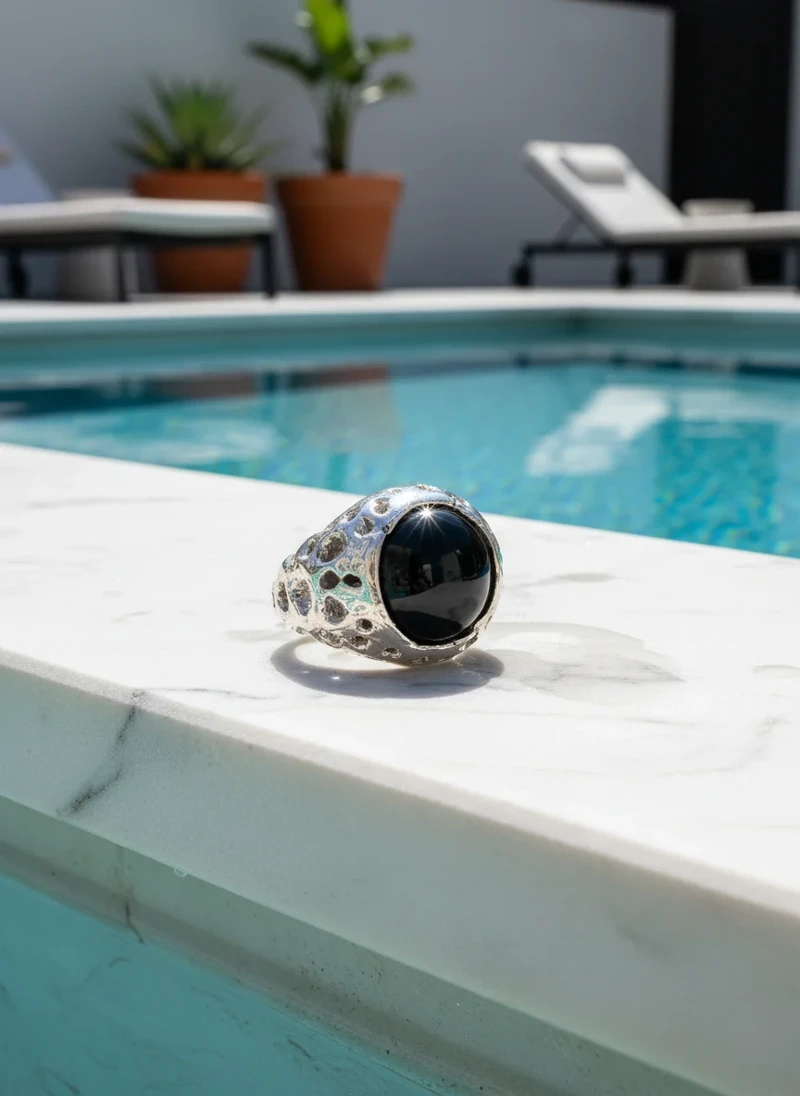 Silver ring with black onyx stone.
