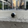 Black onyx silver ring with cutout band.