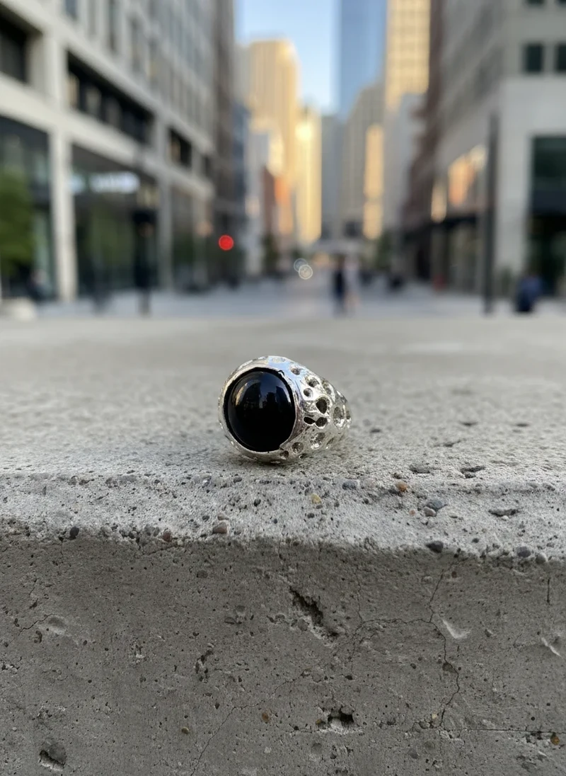 Black onyx silver ring with cutout band.