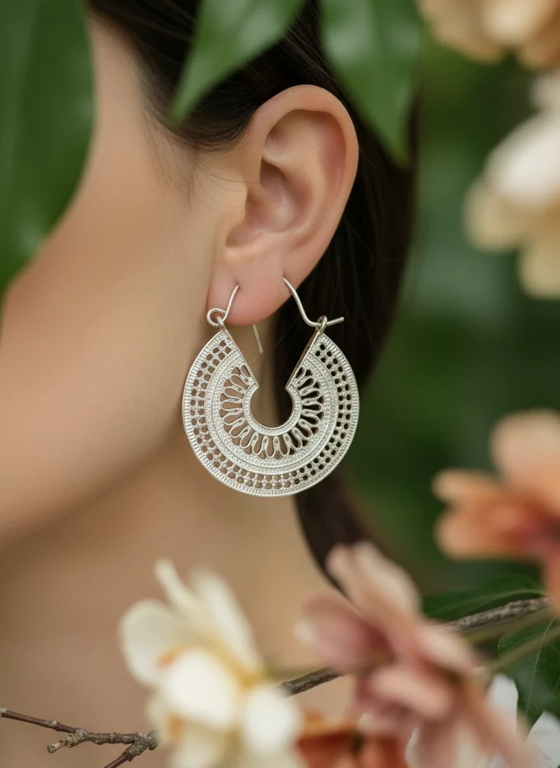 Silver filigree hoop earrings.