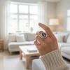 Silver ring with black oval cameo.