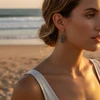 Woman wearing ornate silver heart earrings.
