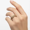 Gold diamond filigree band ring.