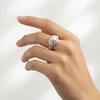 Silver pearl ring with diamond accents.