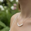 Delicate gold pearl necklace.