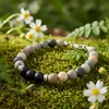 Stone beaded bracelet on moss.
