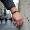 Men's beaded bracelet; gray, black, & beige stones.